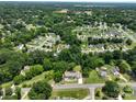 An aerial view displays the neighborhood with lush green trees surrounding well-spaced houses at 2617 Shady Lane Ave, Concord, NC 28027