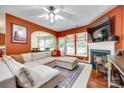 Inviting living room with a fireplace, comfortable seating, and a view of the dining area, creating a welcoming space at 288 Sand Paver Way # 50, Fort Mill, SC 29708