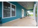 Side porch with cozy seating area, perfect for relaxing and enjoying the outdoor view at 3103 Richview Dr, Crouse, NC 28033