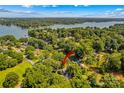Aerial view featuring lake access with an arrow pointing to the property at 315 Wood Duck Loop, Mooresville, NC 28117