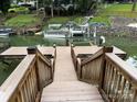 View from the dock and staircase leading to the lake, as well as neighborhood docks and boat parking at 315 Wood Duck Loop, Mooresville, NC 28117