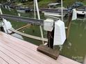 Dock view including boat lift mechanism and electrical, adjacent to wooden platform at 315 Wood Duck Loop, Mooresville, NC 28117