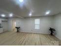 Open-concept living area featuring new floors, ample natural light, and neutral color palette at 39 E White St, Chester, SC 29706