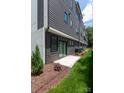 Backyard featuring a grassy area, privacy fence, and a sliding glass door at 4203 Walker Rd, Charlotte, NC 28211