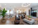 Spacious open-concept living room featuring a modern kitchen and cozy seating with natural light at 4203 Walker Rd, Charlotte, NC 28211