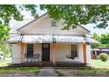 Inviting home exterior with a covered porch and comfortable seating at 505 S Eastway Dr, Troutman, NC 28166