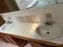 Bathroom vanity with double sinks, tile countertop and backsplash at 506 Royal St # 9-12, East Spencer, NC 28144