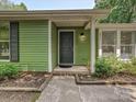 Inviting front entrance with a pathway to the black front door at 5811 Rock Hollow Dr, Charlotte, NC 28212