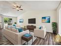 Staged living room with vaulted ceilings and hardwood floors at 5811 Rock Hollow Dr, Charlotte, NC 28212