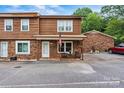 Exterior view of the brown home with a small porch and well-maintained parking at 729 Tenth Ne Ave, Hickory, NC 28601
