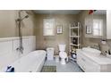 Bright bathroom features a free standing tub, walk in shower, and sleek vanity at 751 Northbrook Iii School Rd, Vale, NC 28168