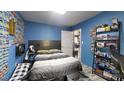 This bedroom has decoratively adorned walls, and a grey upholstered bed set at 751 Northbrook Iii School Rd, Vale, NC 28168