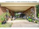 Spacious covered patio with outdoor seating, perfect for enjoying the outdoors in comfort at 7518 Surry Ln, Indian Trail, NC 28079