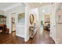 Elegant foyer with hardwood floors, skylight, and views of the living room and kitchen at 8109 Hawk Crest Ct, Charlotte, NC 28270