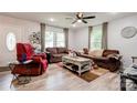 Cozy living room with wood-look flooring, filled with natural light, providing a comfortable gathering space at 812 Kings Rd, Shelby, NC 28150
