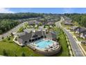 Aerial view showcases the community clubhouse and pool amenities, surrounded by well-maintained homes at 9435 Liberty Hill Dr, Mint Hill, NC 28227