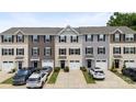 Street view of townhouses with landscaping, driveways, and attached garages at 999 Rushing Ln # 13, Fort Mill, SC 29715