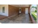 Covered carport featuring a brick facade and providing covered access to the home at 1613 Spangler Dr, Shelby, NC 28150