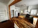 Spacious kitchen with butcher block countertops, ample storage and stainless steel appliances at 208 S Ransom St, Gastonia, NC 28052