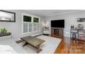 Cozy living room with hardwood floors, neutral walls, and modern decor, creating a comfortable atmosphere at 4200 Tyndale Ave, Charlotte, NC 28210