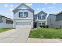 Charming two-story home featuring a gray siding, attached garage, and well-maintained landscaping at 4313 Gibbon Crossing Dr, Charlotte, NC 28269