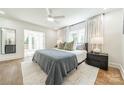 Airy bedroom with hardwood floors, a ceiling fan, and a view of the outdoors at 601 Cherokee Rd, Charlotte, NC 28207