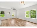 Bright living room with hardwood floors, a ceiling fan, and lots of natural light at 605 Poplar St, Shelby, NC 28150