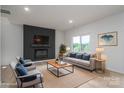 Cozy living room with a fireplace, sleek furniture, and neutral colors at 823 32Nd Ne St, Conover, NC 28613