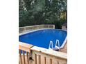 Enjoy this backyard pool with a new wooden deck that is perfect for summer fun and relaxation at 106 Condover Pl, Charlotte, NC 28270