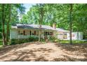 Traditional home exterior with red shutters, a well-maintained yard, and an attached garage at 116 April Ln, Dallas, NC 28034
