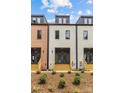 New construction townhomes featuring multiple stories and welcoming front entries at 1356 Briar Creek Rd, Charlotte, NC 28205