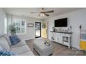 Bright living room featuring modern decor, wood floors, and a clear view of the entryway at 154 Stella Ln # A, Troutman, NC 28166