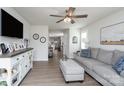 Bright living room featuring an entertainment console, comfortable seating, and wood floors at 154 Stella Ln # A, Troutman, NC 28166