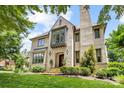 Beautiful exterior of this home with a manicured lawn and lush trees providing a picturesque setting at 1728 Shadow Forest Dr, Matthews, NC 28105