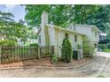 Cozy backyard with a wooden fence and mature trees at 4014 Sulkirk Rd, Charlotte, NC 28210