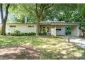 Beautiful single-story home with mature trees and a carport at 5742 Murrayhill Rd, Charlotte, NC 28210