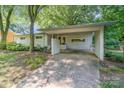 Beautiful single-story home with mature trees and a carport at 5742 Murrayhill Rd, Charlotte, NC 28210