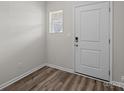 Bright entryway featuring stylish, modern flooring and a secure, white front door at 853 Gerard Bay Dr, Fort Mill, SC 29715