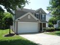 Charming two-story home with a two-car garage, well-maintained landscaping, and inviting curb appeal at 10516 Pickerel Ln, Charlotte, NC 28213