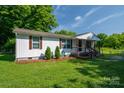 Inviting single story home featuring a classic covered front porch and green front lawn at 1212 Frank Ext, Rock Hill, SC 29730