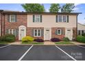 Charming townhome with brick accents, green shutters, and well-maintained landscaping at 1330 5Th Ne St, Hickory, NC 28601