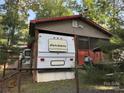 Rear view of home exterior and boat, highlighting the ample space and recreational opportunities at 160/162 Arrowood Trl # F28/F29, Mount Gilead, NC 27306