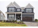 Beautiful two-story home featuring a two-car garage, covered entry, and attractive landscaping at 236 Paradise Dr, Belmont, NC 28012