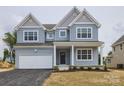 Attractive two-story home with a one-car garage and inviting front entrance at 236 Paradise Dr, Belmont, NC 28012