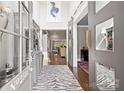 Elegant foyer with high ceilings, hardwood floors, and stylish zebra rug at 2501 Christenbury Hall Nw Ct, Concord, NC 28027