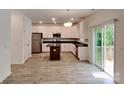 Modern kitchen with stainless steel appliances and center island at 2612 Cold Springs Rd, Concord, NC 28025