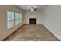 Spacious living room featuring wood floors, fireplace and plenty of natural light at 2612 Cold Springs Rd, Concord, NC 28025