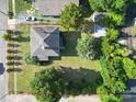 Aerial view of a property with a well-maintained yard and surrounding neighborhood at 309 S Greene St, Wadesboro, NC 28170