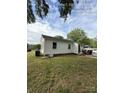 Image displaying the back of a single-story home with a well-maintained lawn and functional exterior at 322 Buffalo St, Shelby, NC 28150