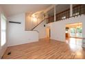 Spacious living room with wood floors and staircase at 3221 5Th Street Nw Ct, Hickory, NC 28601
